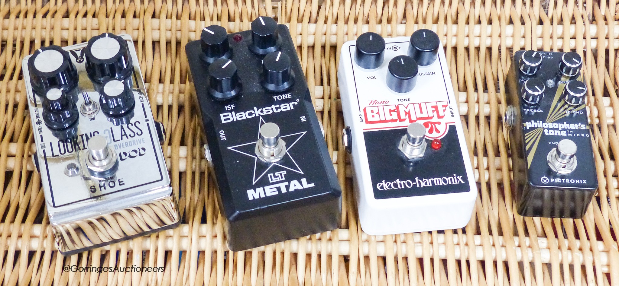 A DOD Looking Glass overdrive pedal, Pigtromx Philosophers tone micro pedal, Nano big muff electro-harmonix pedal and Blackstar LT metal pedal